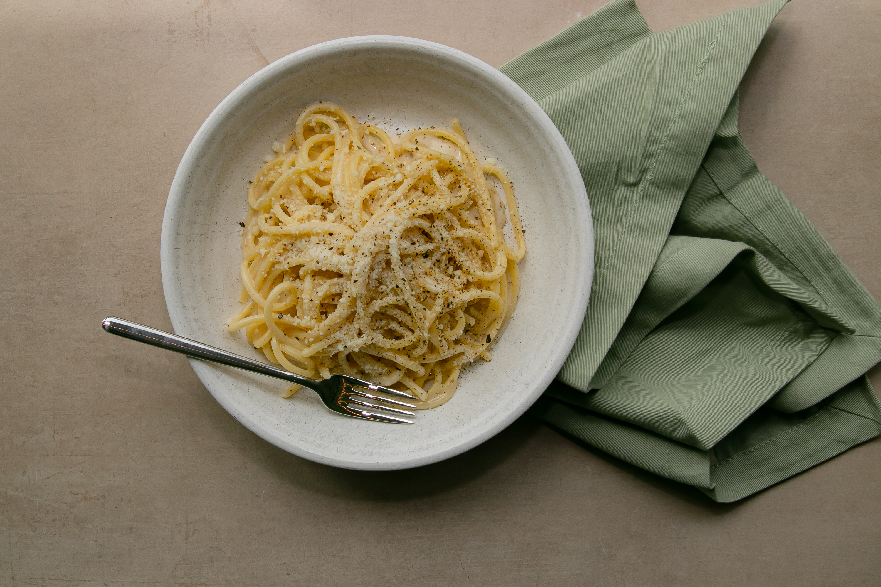 a bowl of spaghetti with a fork