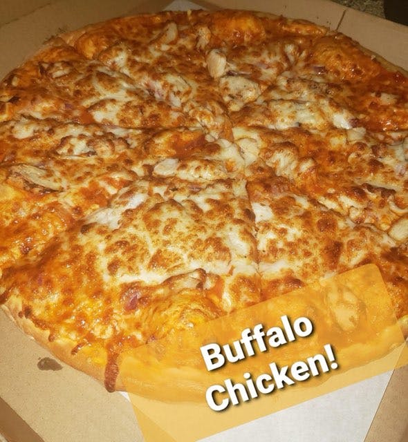a pizza sitting on top of a counter