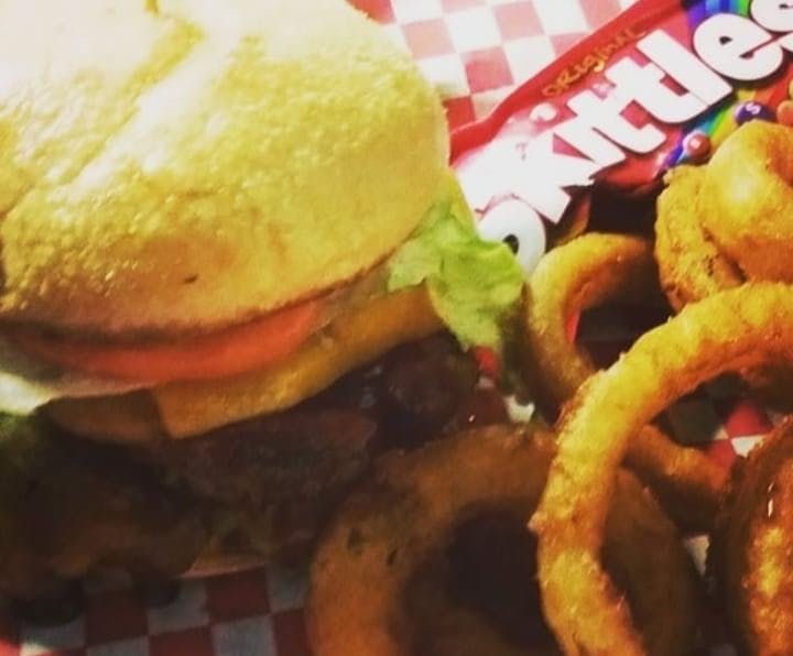 a close up of a sandwich and fries on a plate