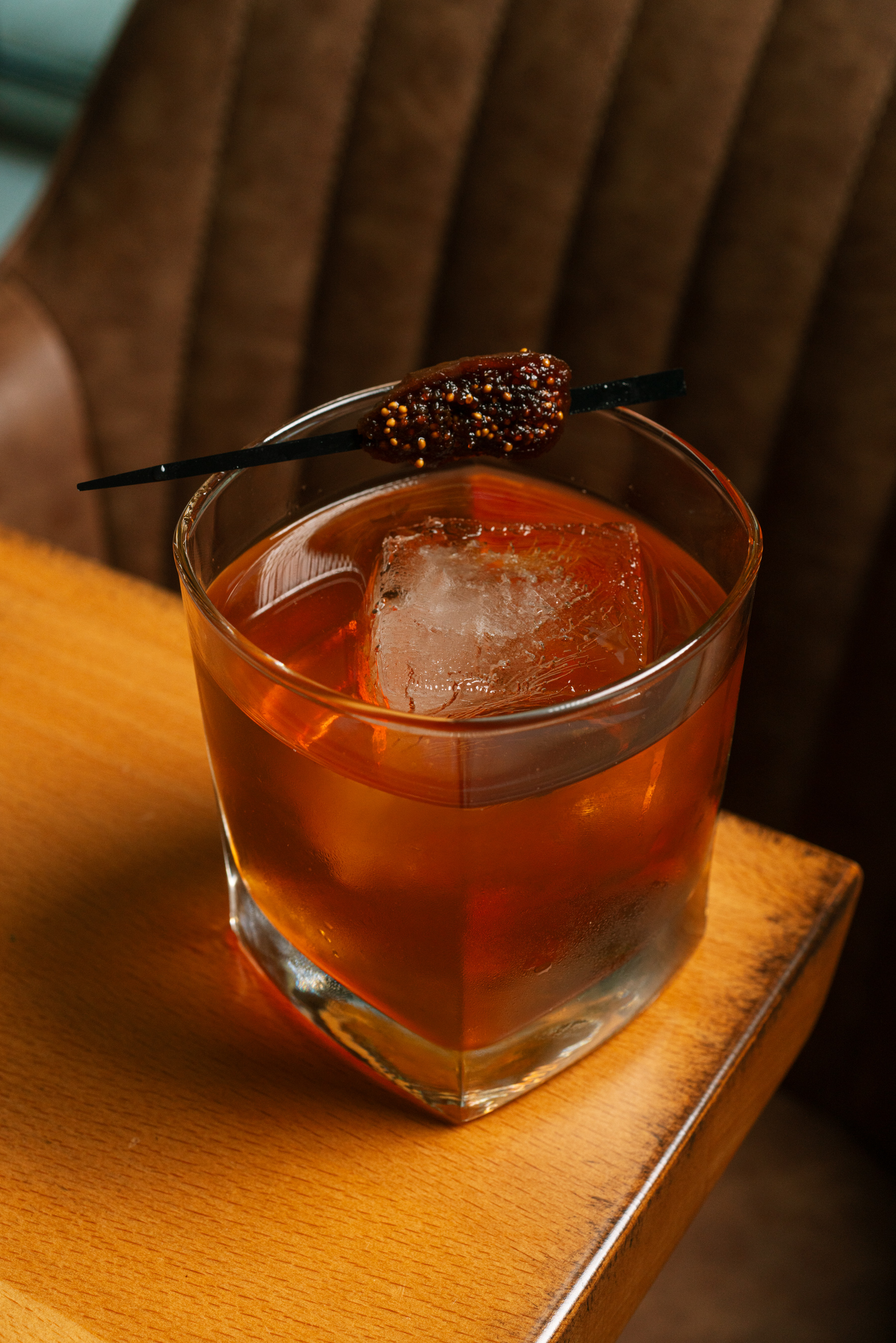 a close up of a glass cup on a wooden table