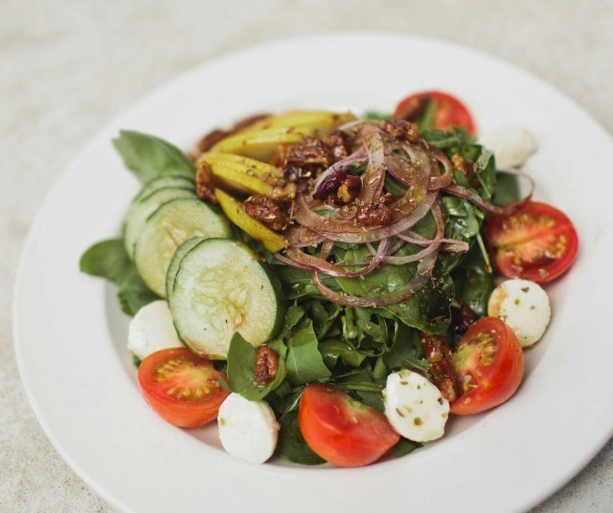 a plate of food with meat and vegetables