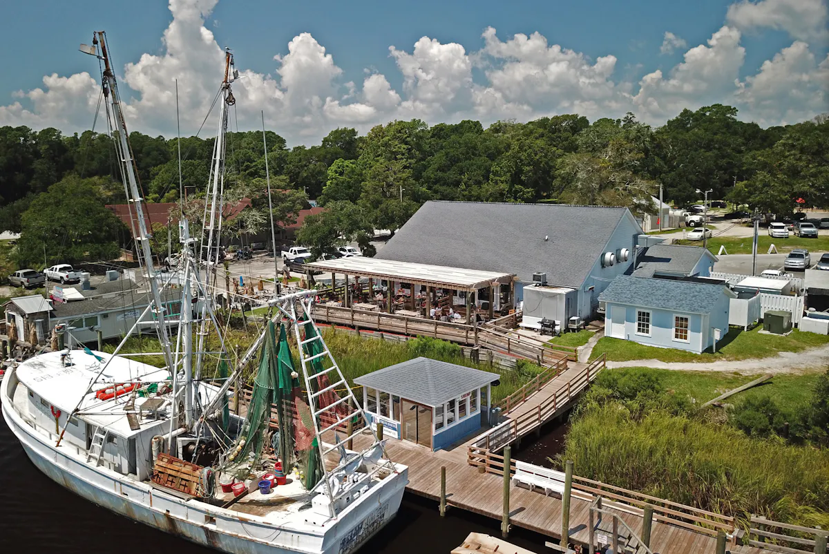 a boat is docked next to a body of water