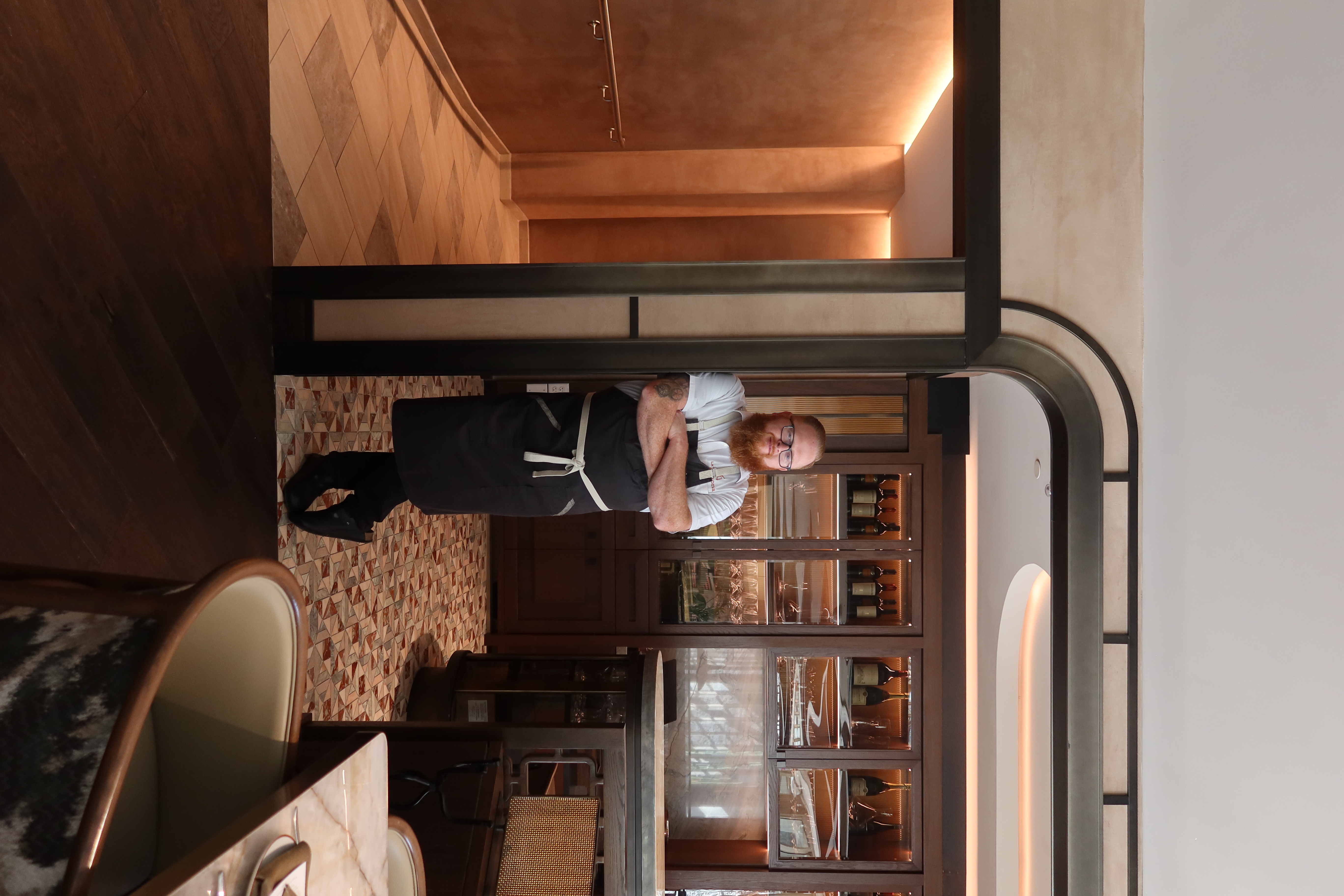 picture of a man leaning on a wall