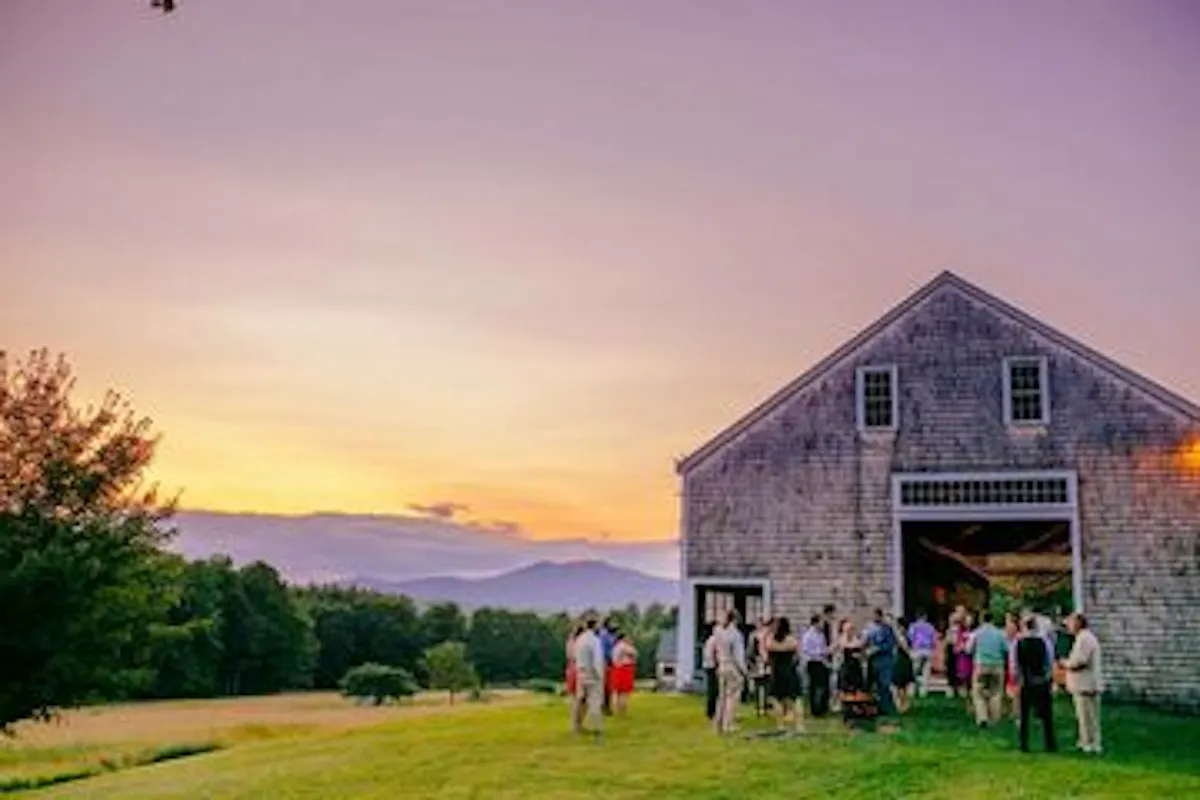 a group of people standing in front of a house