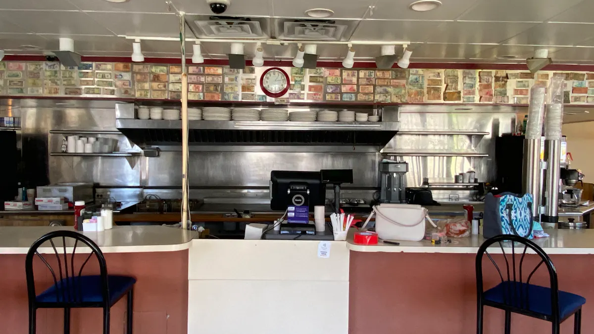 a kitchen with a table in a restaurant