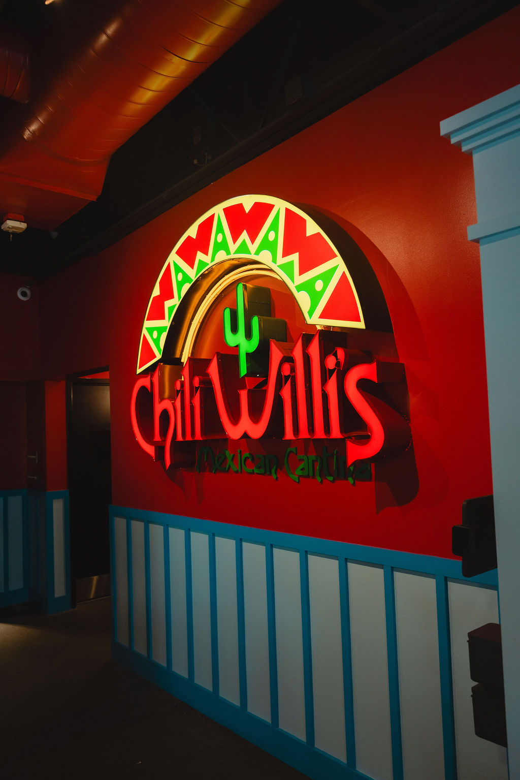 a neon sign on a wall