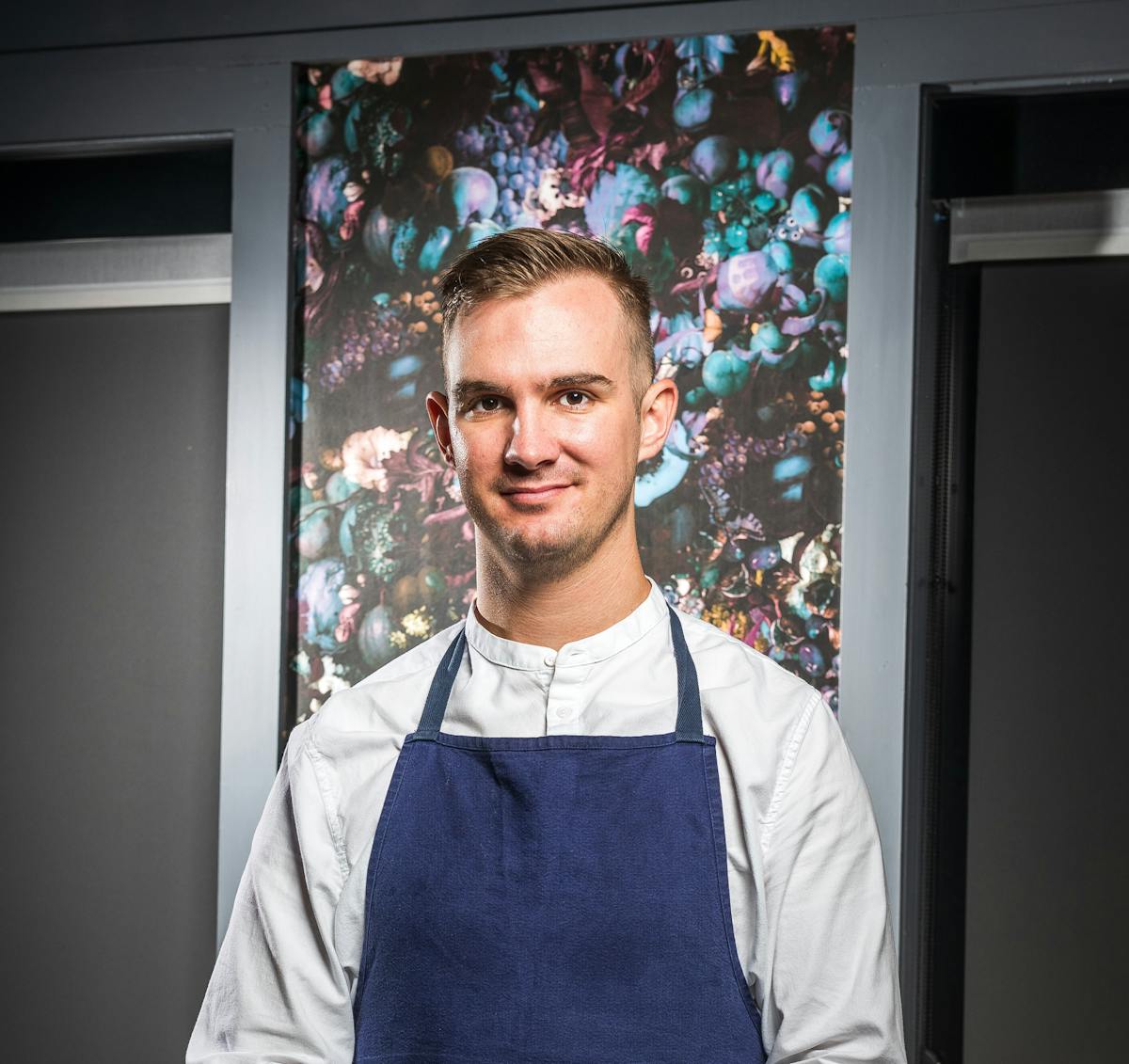 a man standing in front of a window