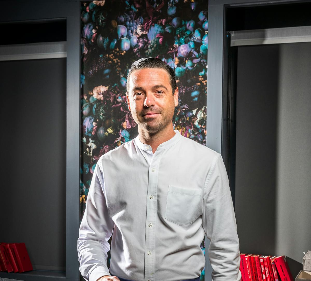 a man standing in front of a window