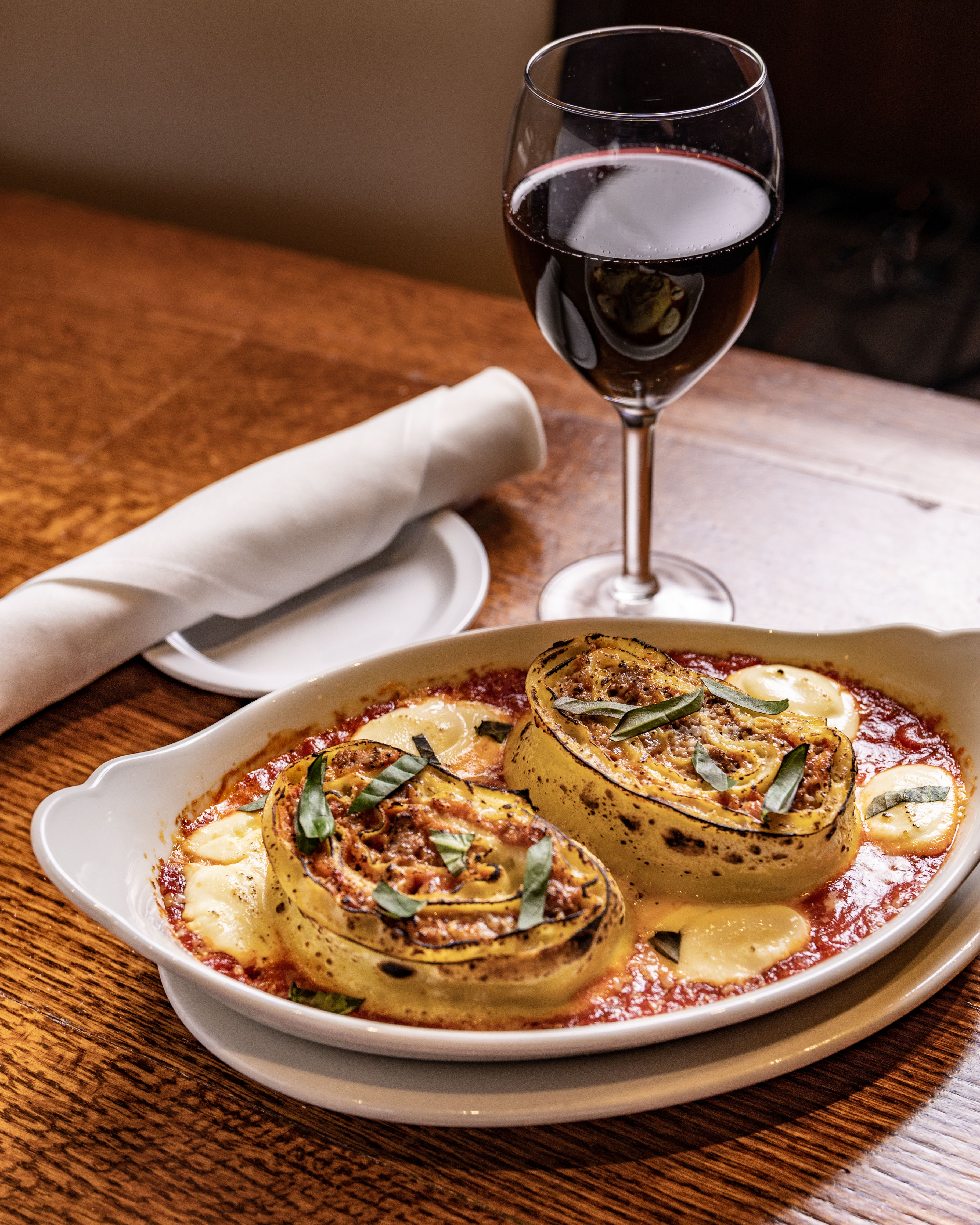 a plate of food and a glass of wine