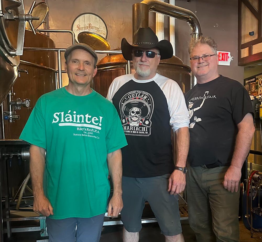 May be an image of 3 people and text