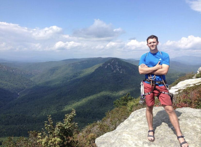 a man standing on top of a mountain