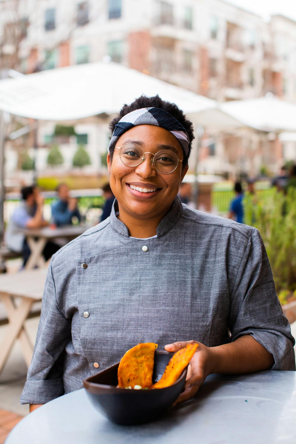 a person holding a hot dog