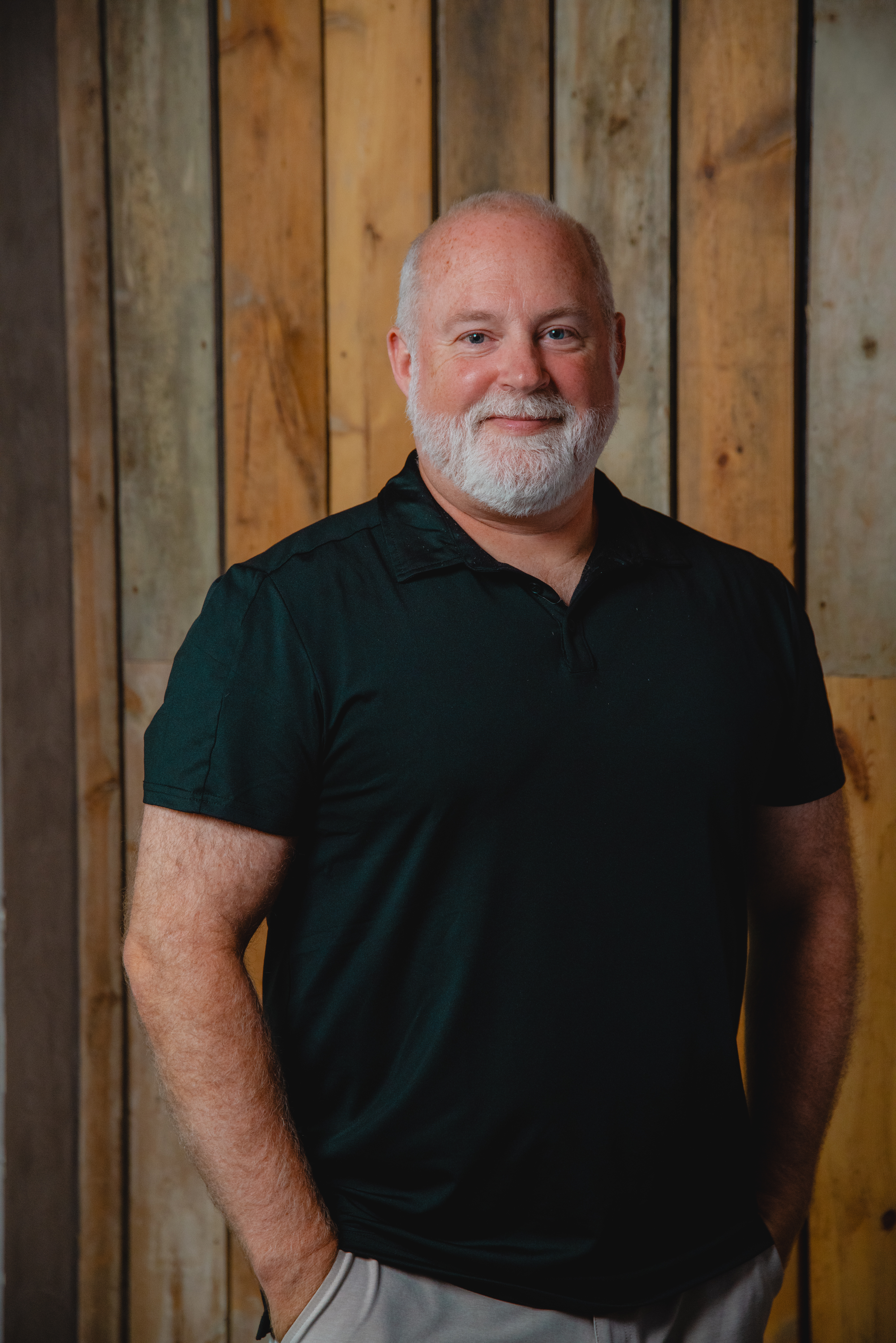 a man with a beard and mustache in a black shirt