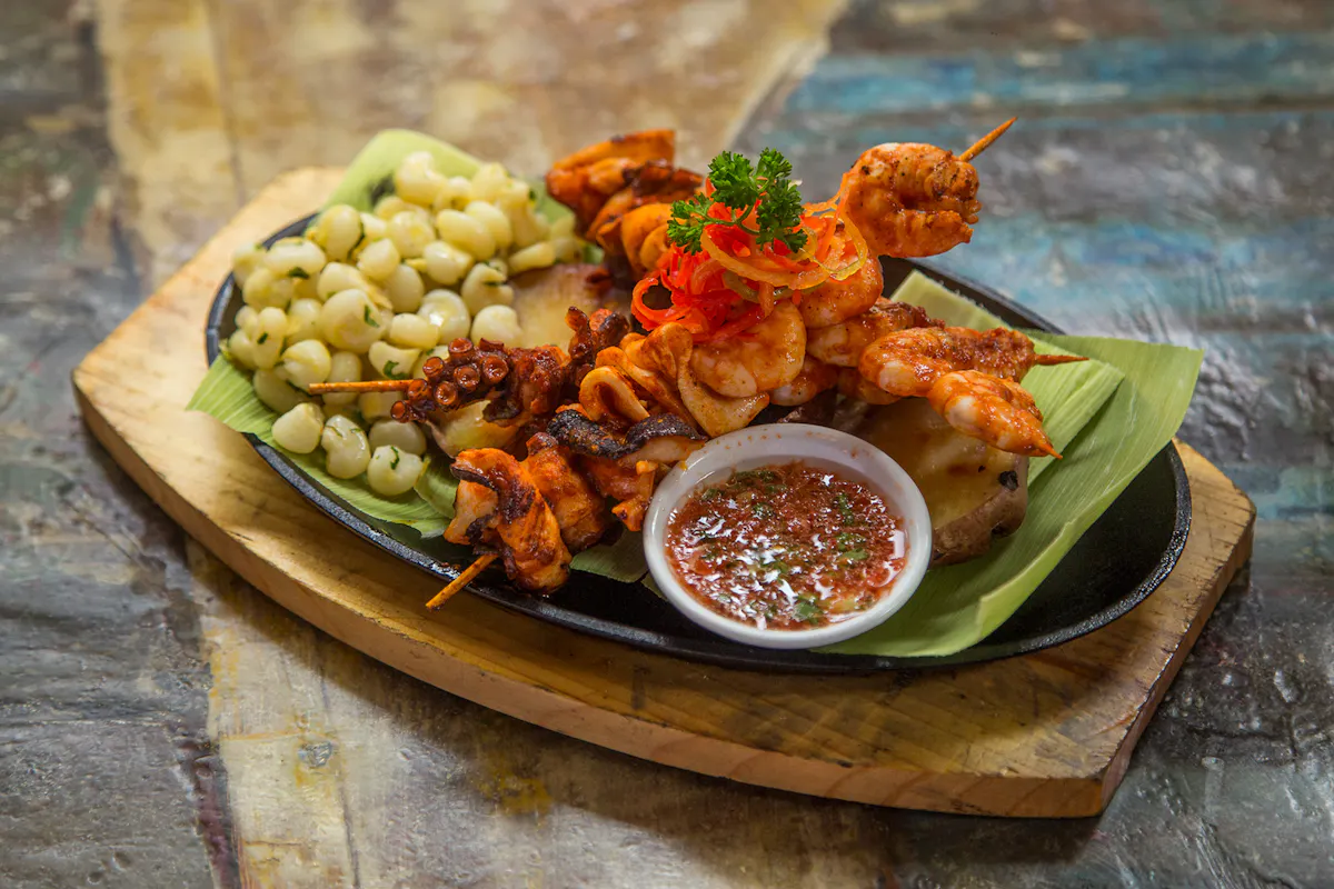 a plate of food sitting on top of a wooden table