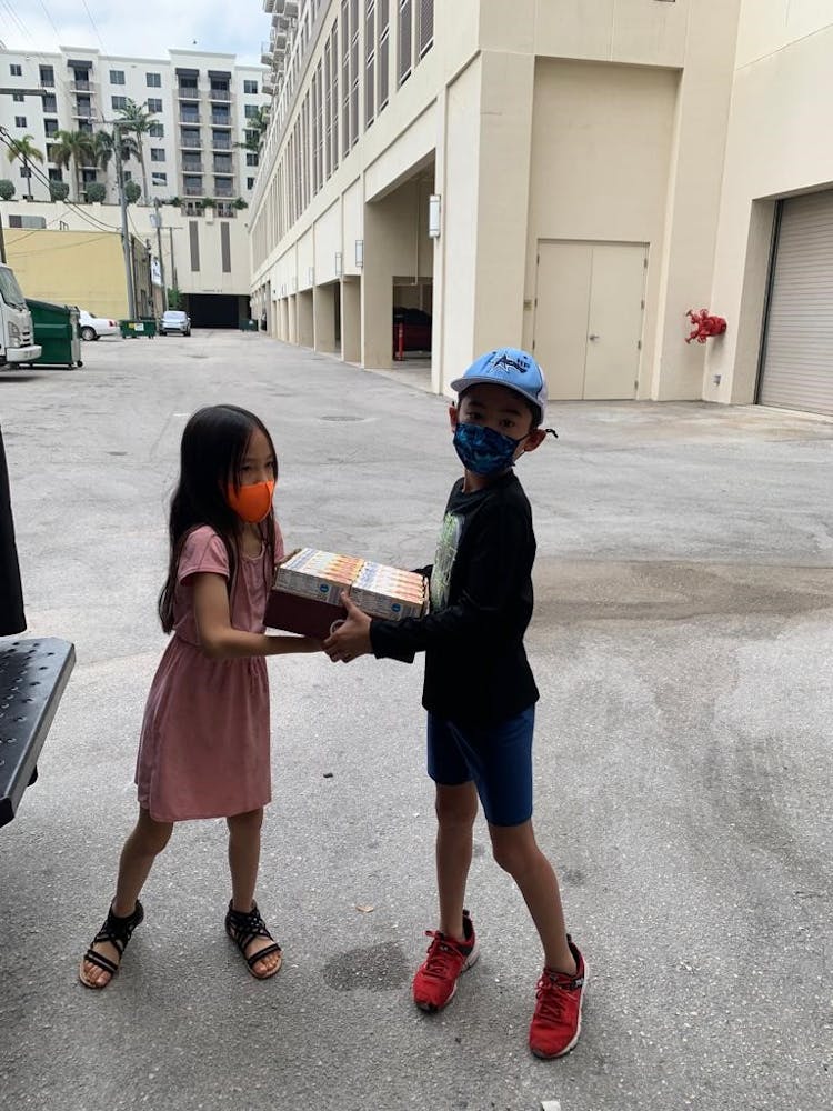 a little boy that is standing in the street