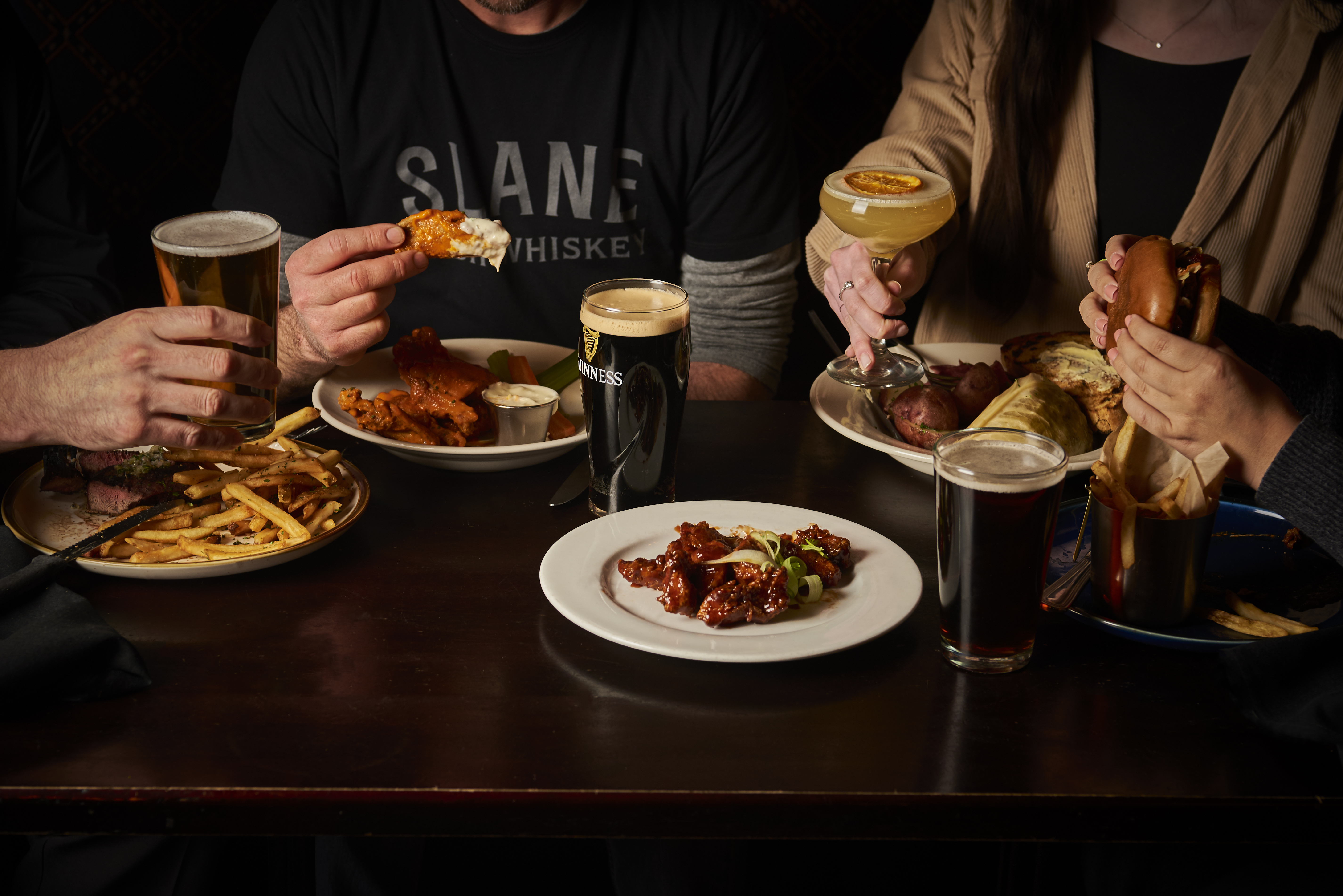 a person sitting at a table with a plate of food