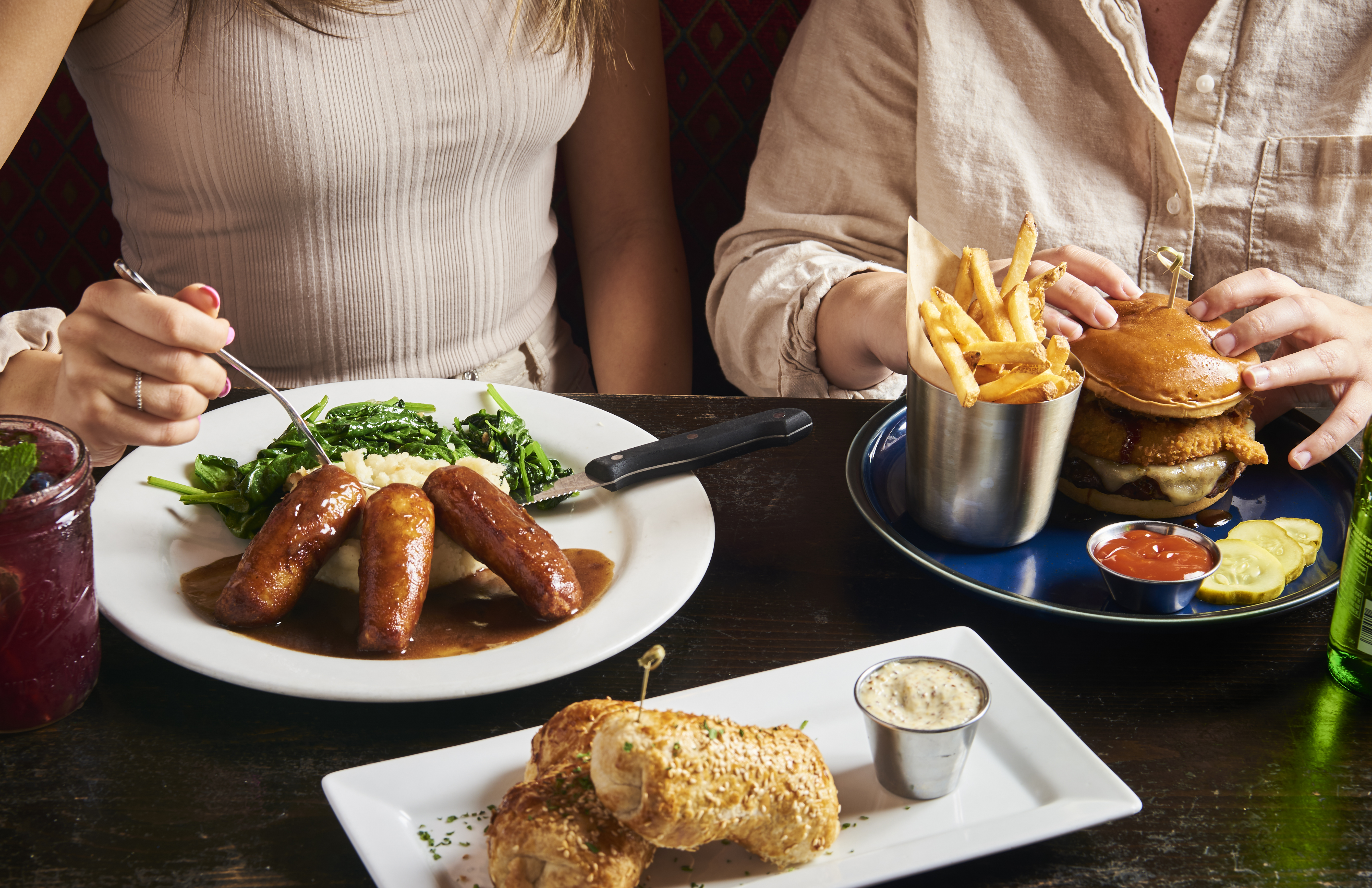 a person sitting at a table with a plate of food