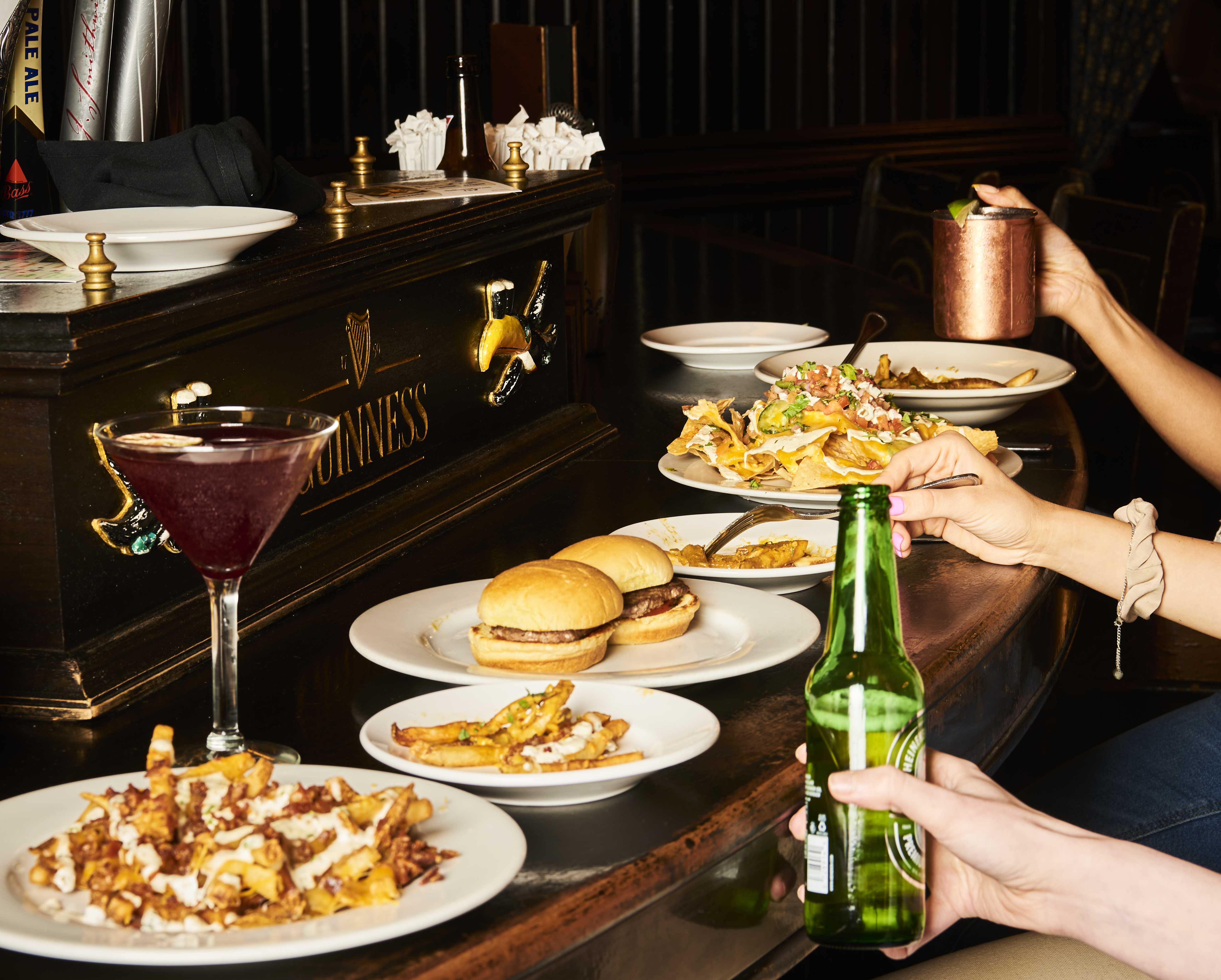 a person sitting at a table with a plate of food