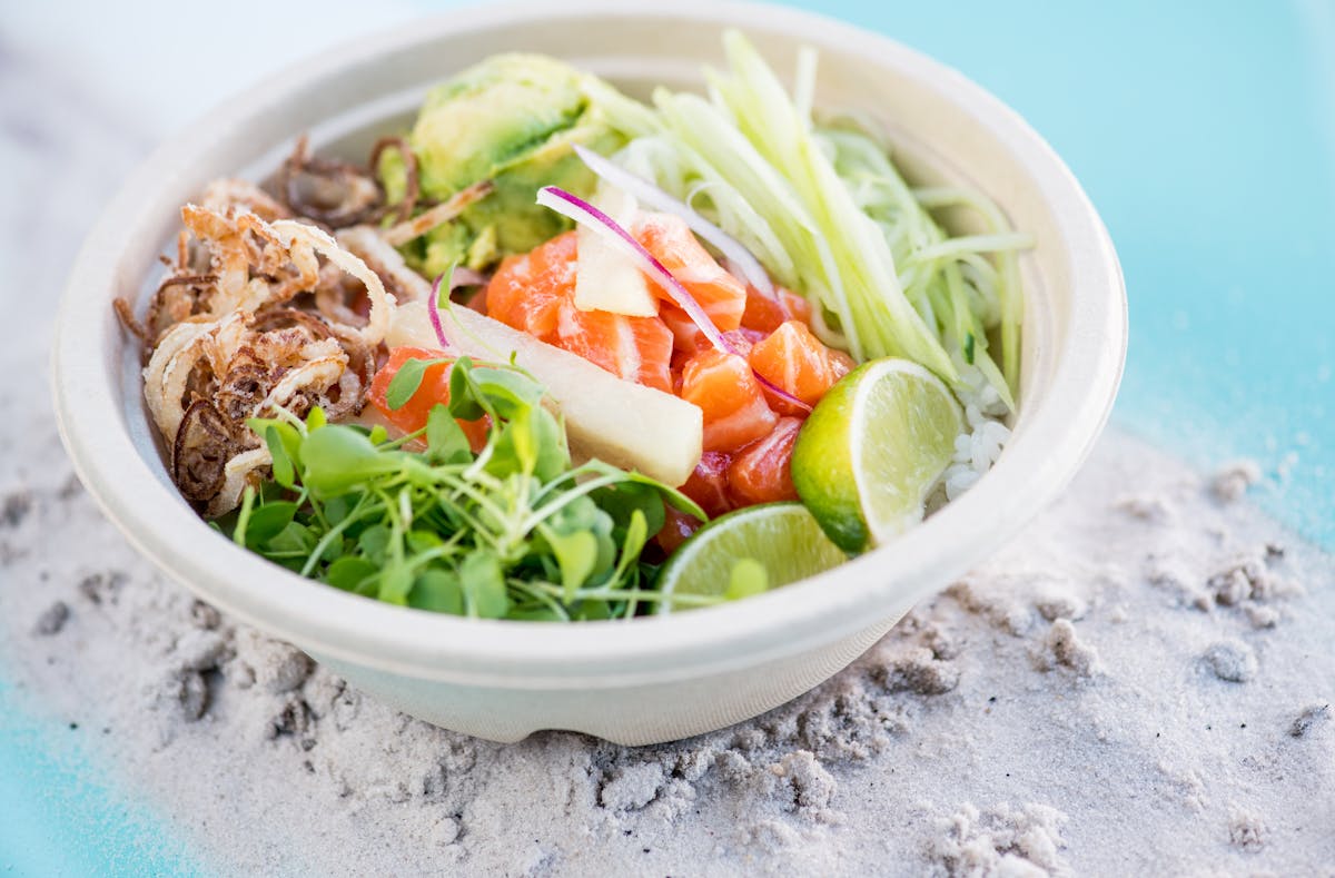 a bowl filled with a green salad