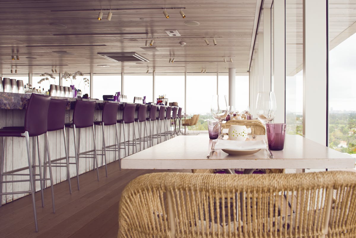 a bar room filled with chairs