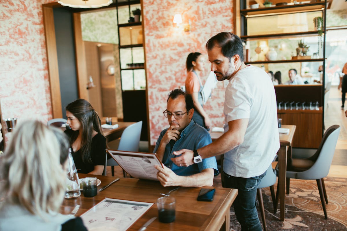 a group of people sitting at a table