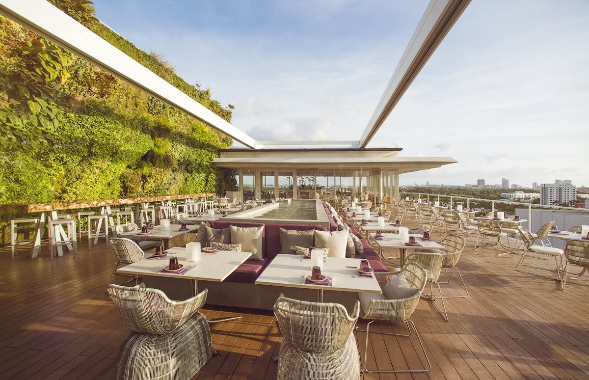 a large patio filled with tables and chairs