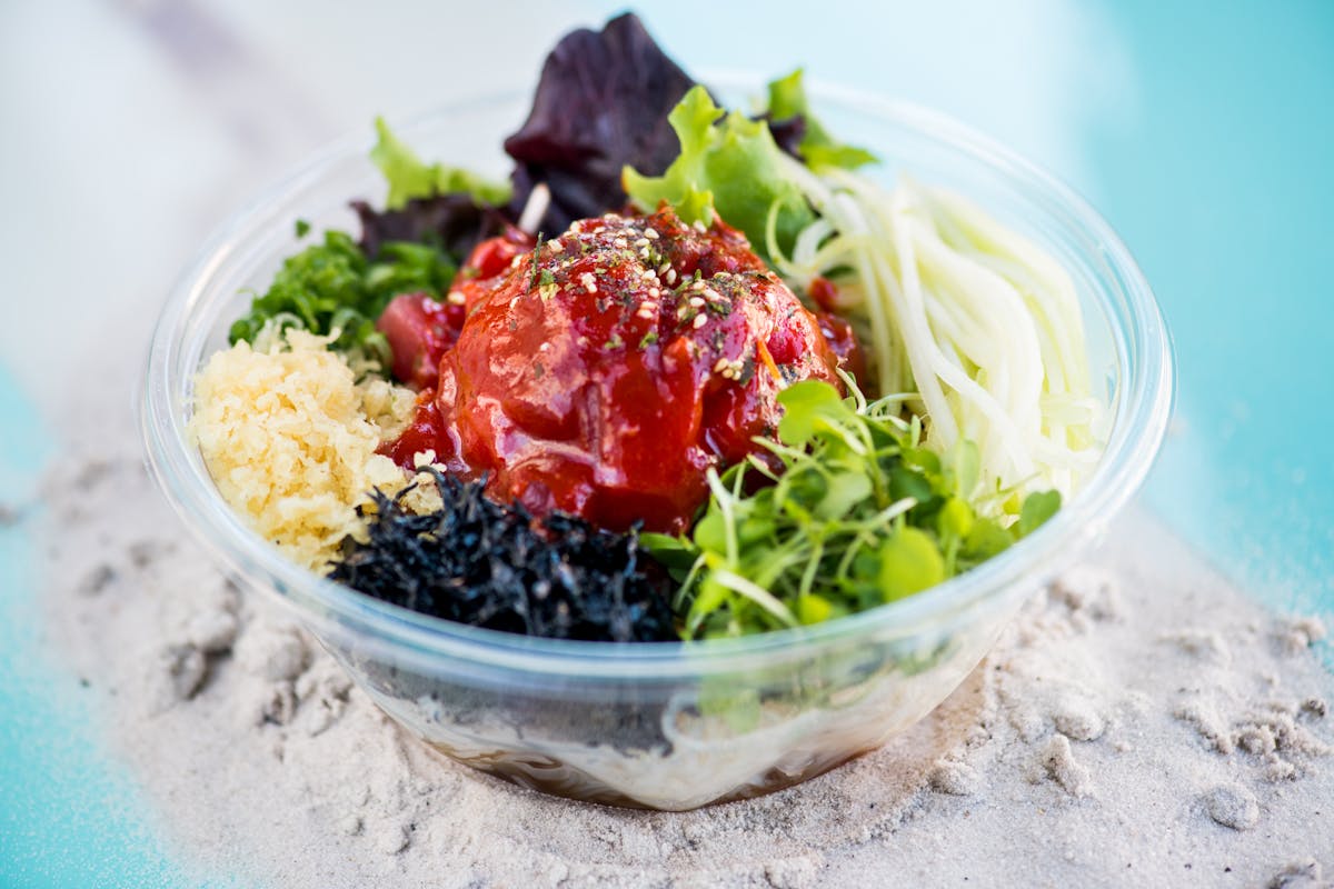 a bowl filled with a green salad