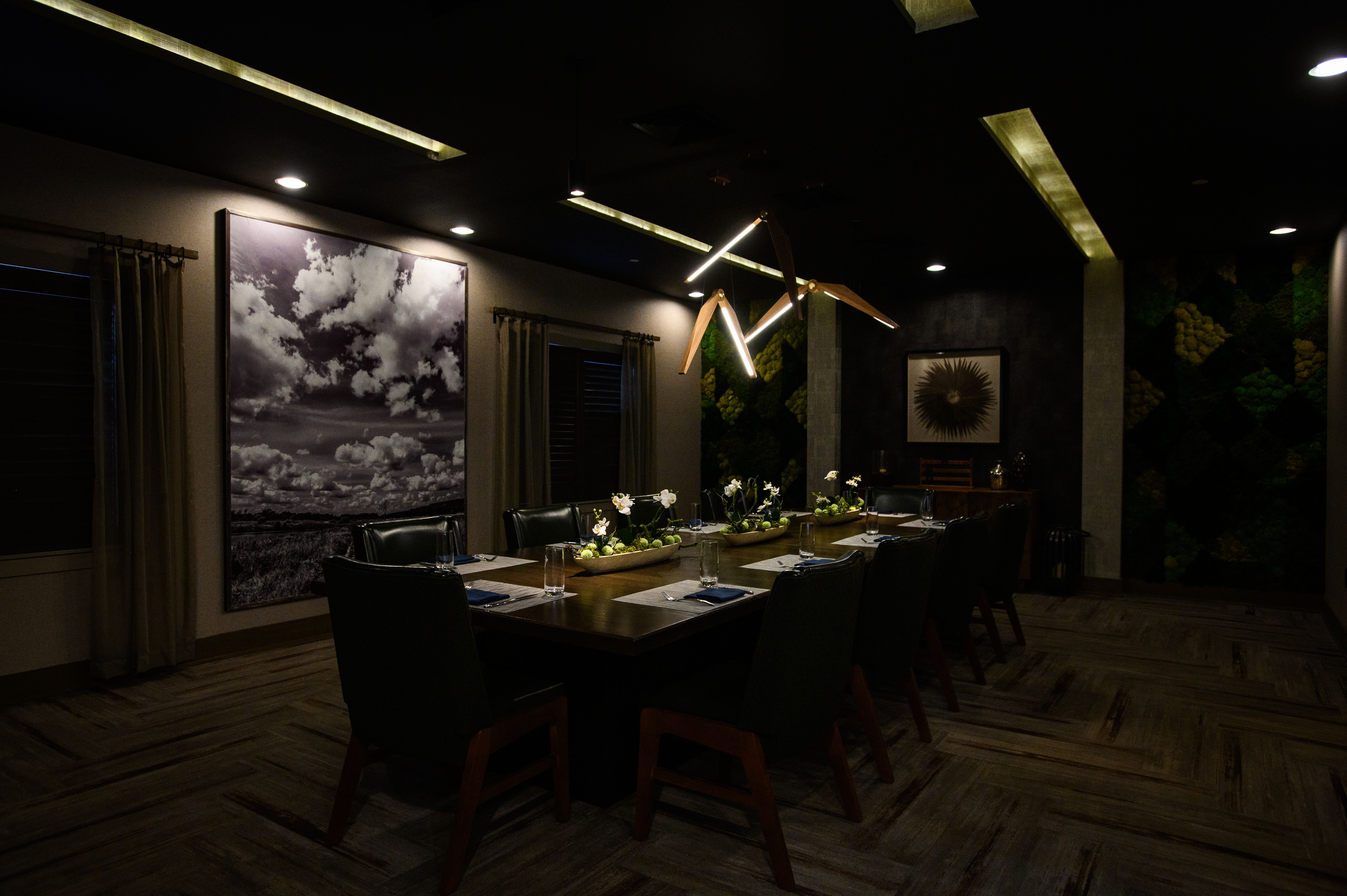 a room filled with furniture and vase on a table