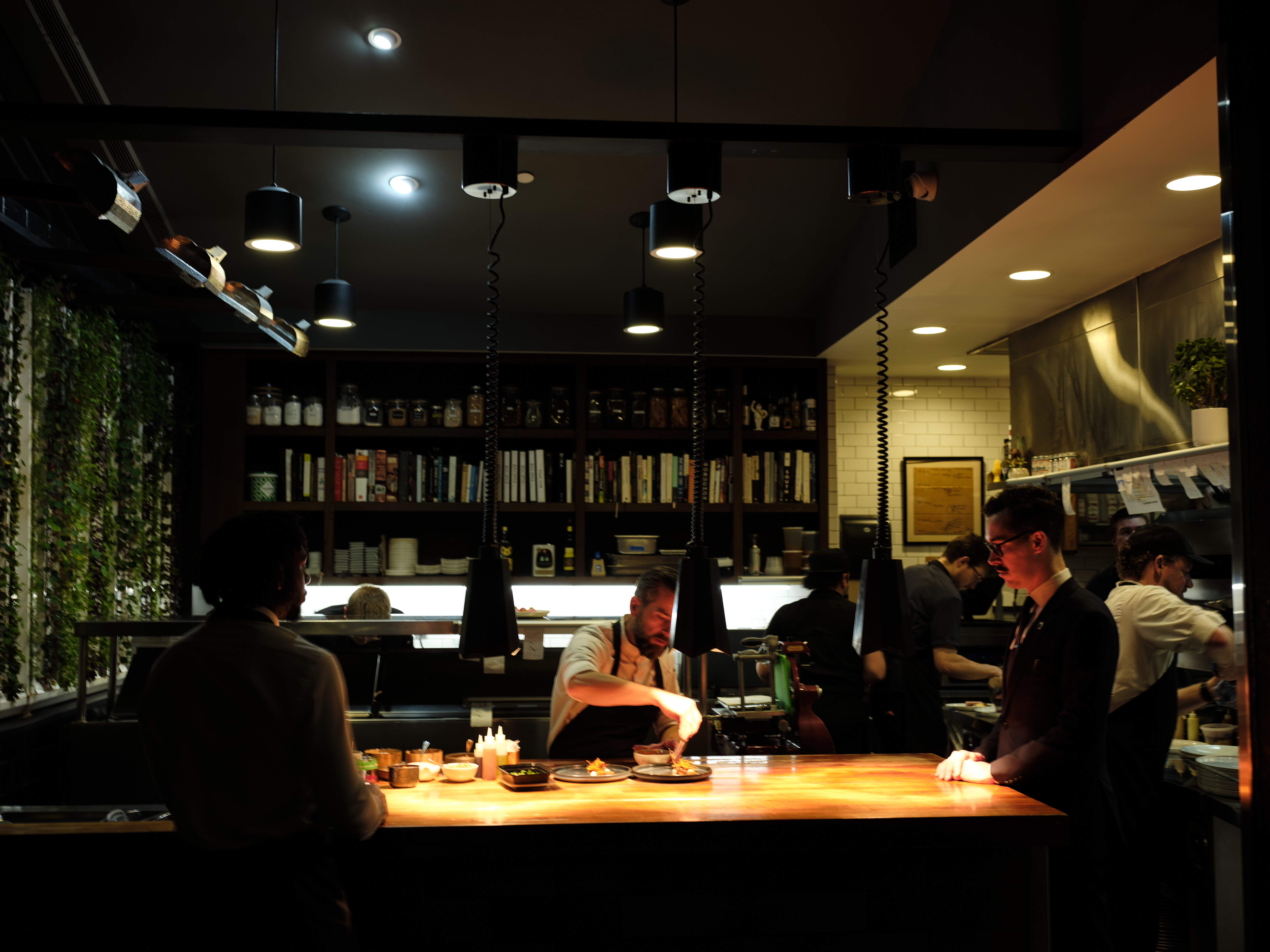 a group of people sitting at a bar