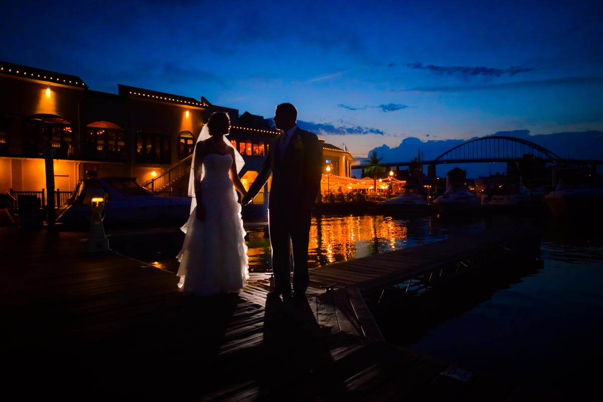 Couple enjoying waterfront wedding reception