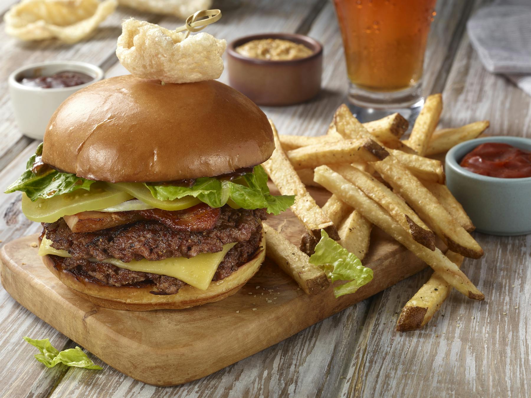 a cut in half sandwich sitting on top of a wooden table