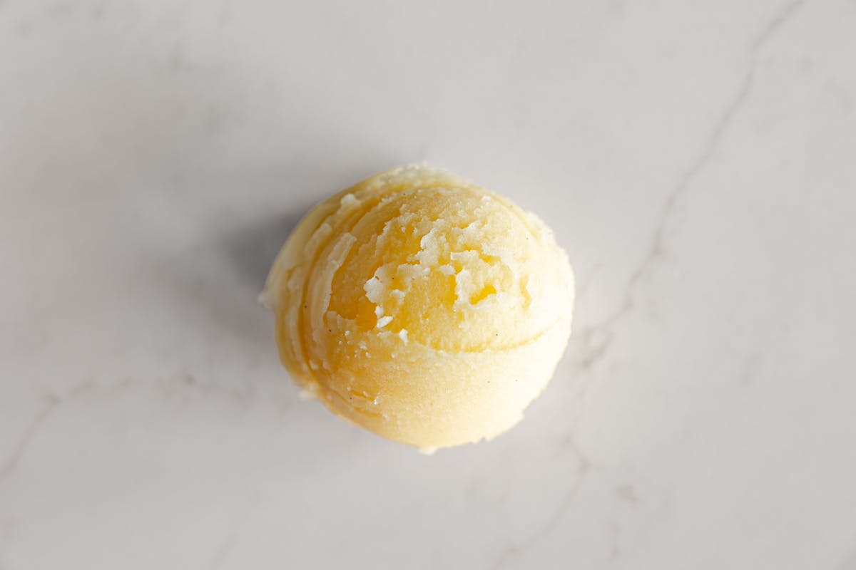 a scoop of orange vanilla bean italian ice