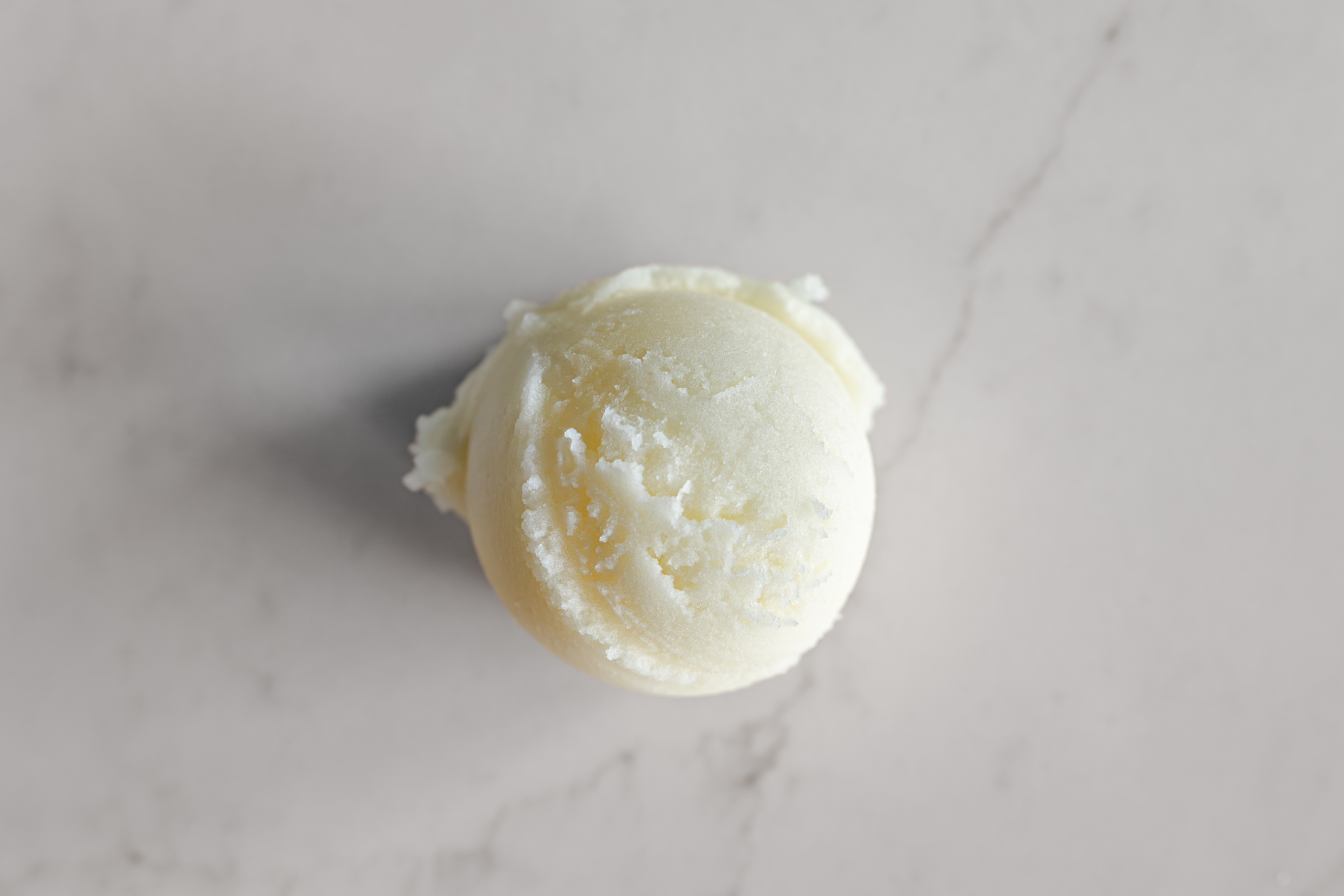 a scoop of pineapple coconut italian ice
