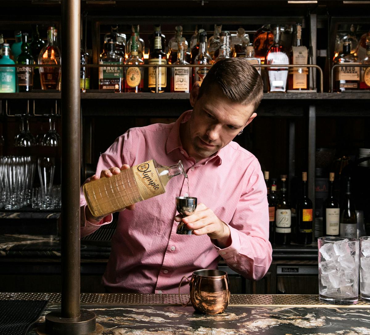 a man holding a bottle of wine
