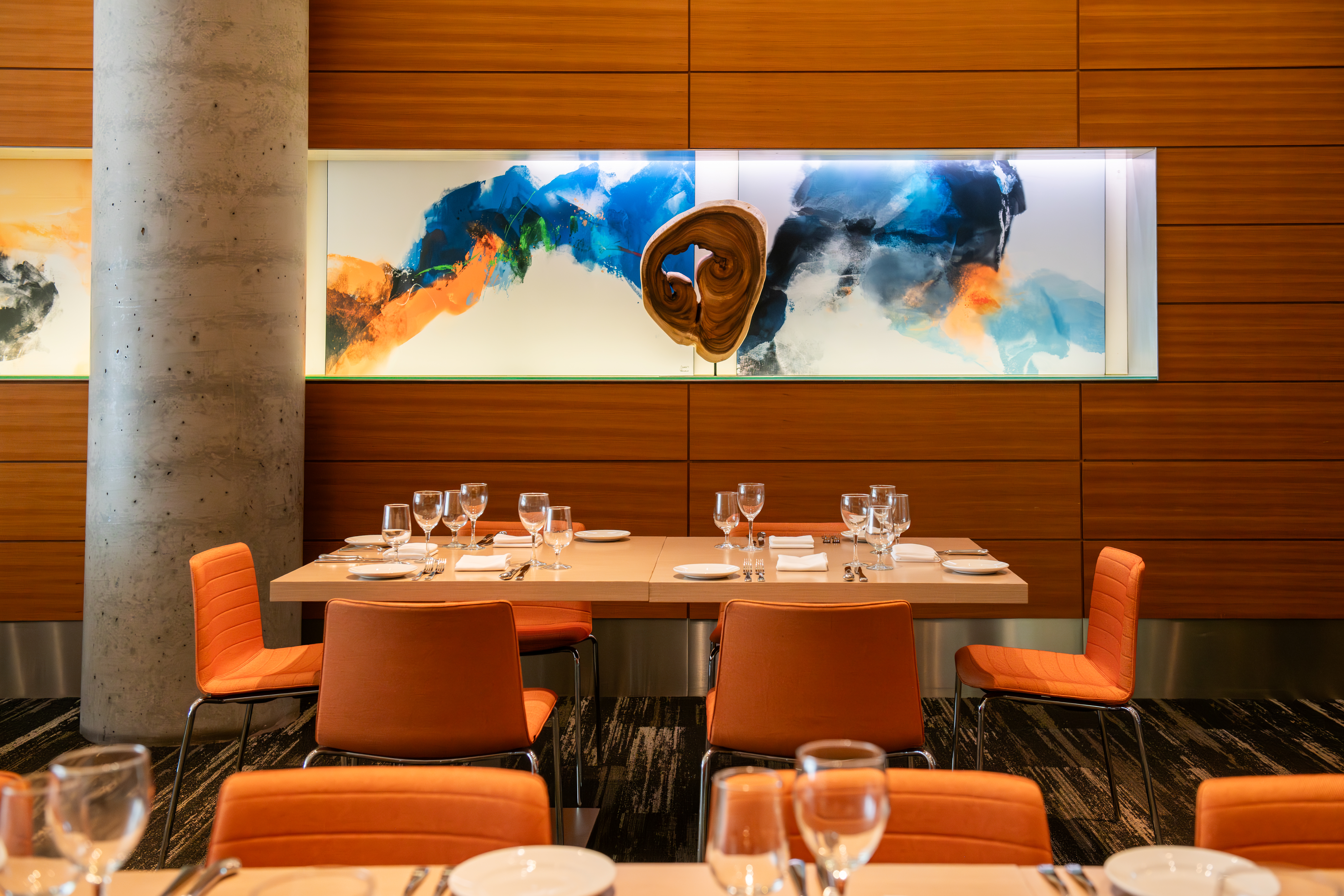 a room filled with furniture and vase of flowers on a table