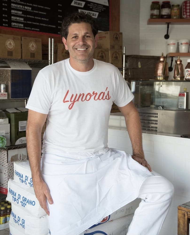 a man standing in a kitchen