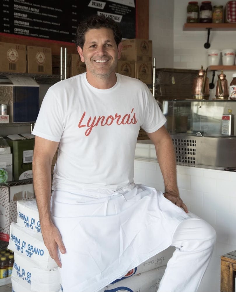 a man standing in a kitchen