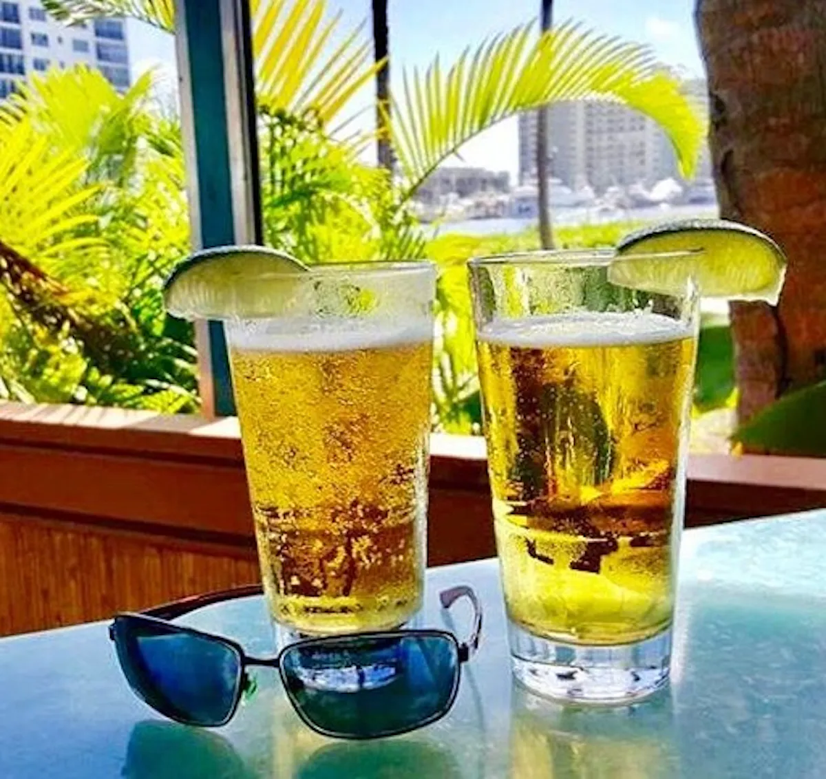 a glass of beer on a table at Deck 84
