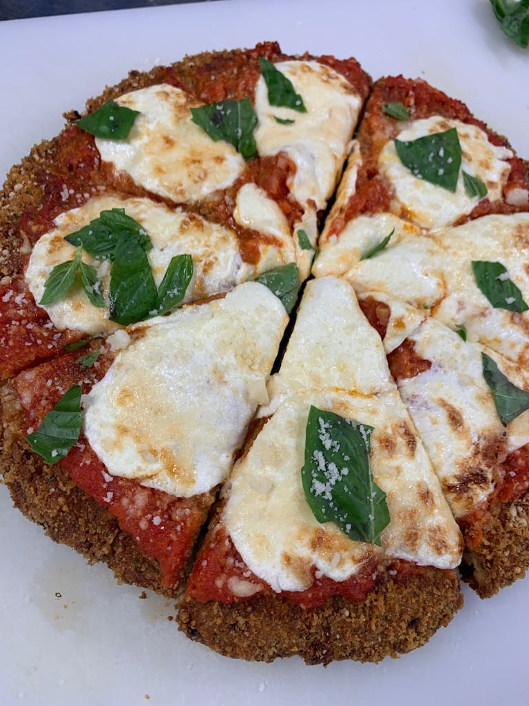 a close up of a plate of food with a slice of pizza