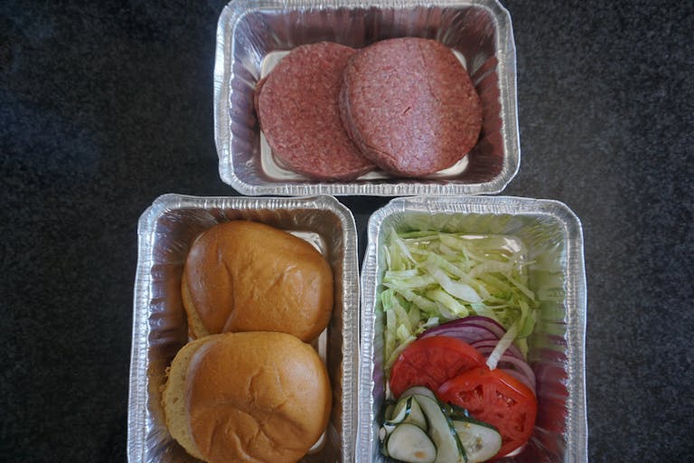 a box filled with different types of food on a tray