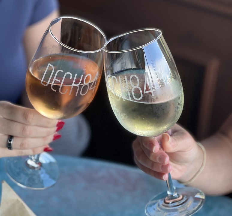 two glasses of wine at waterfront restaurant in delray beach