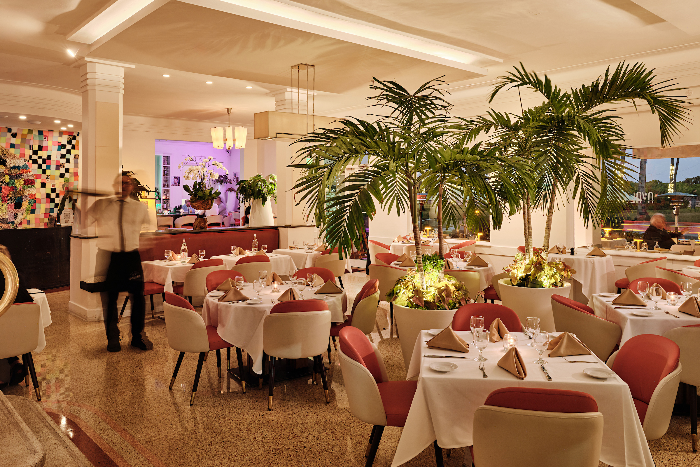 a restaurant with tables and chairs