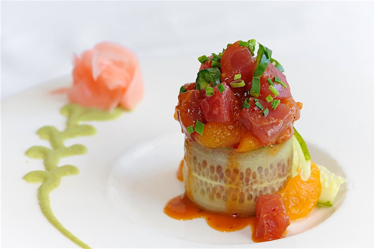 a plate of the spicy bigeye tuna tartar wrapped in a cucumber slice