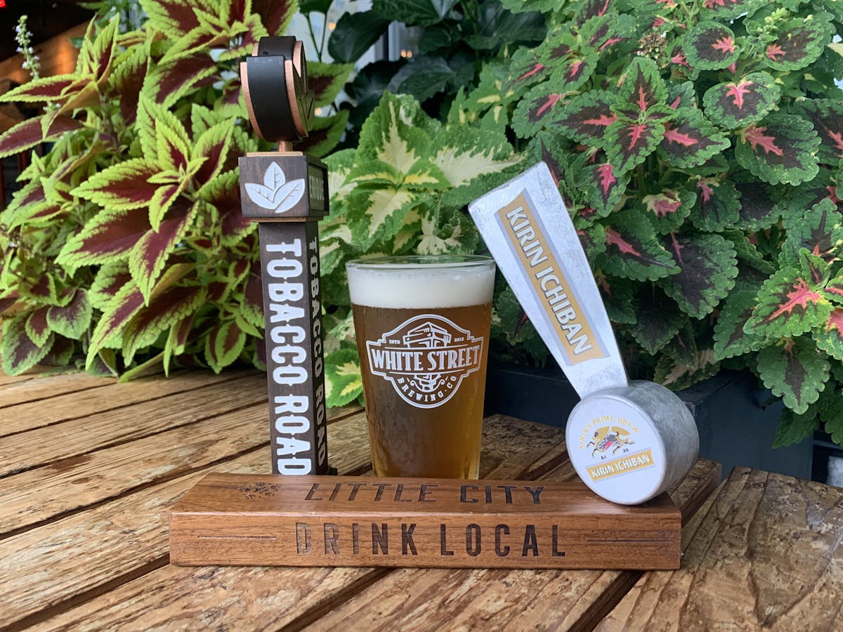 a beer glass and beer handles