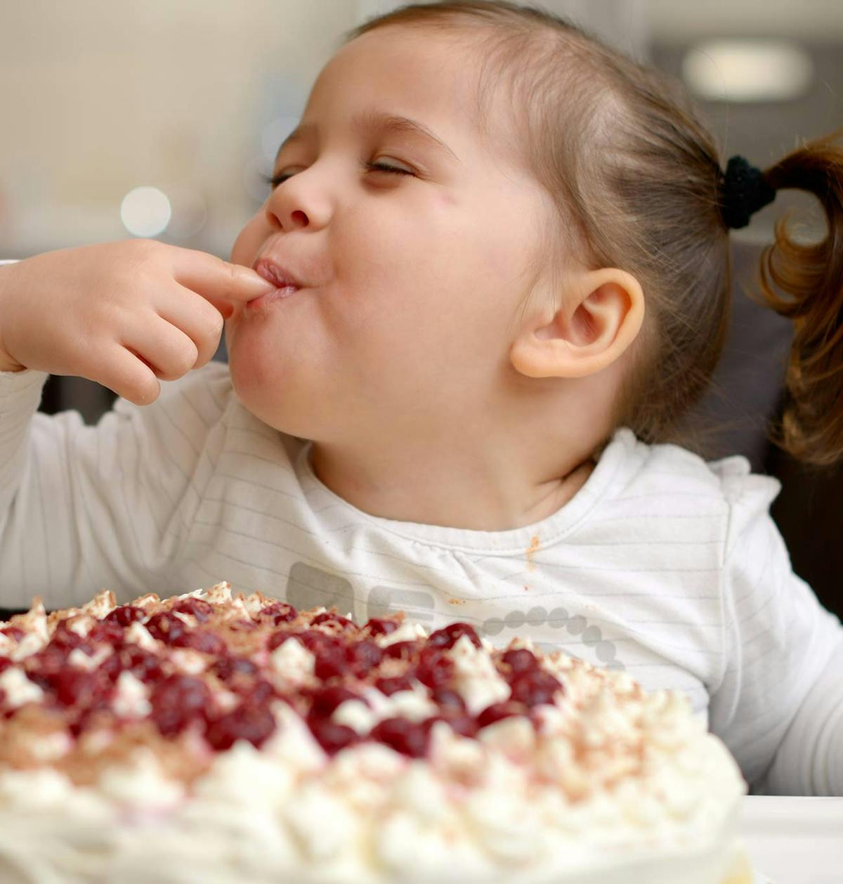 a little boy that is eating some food