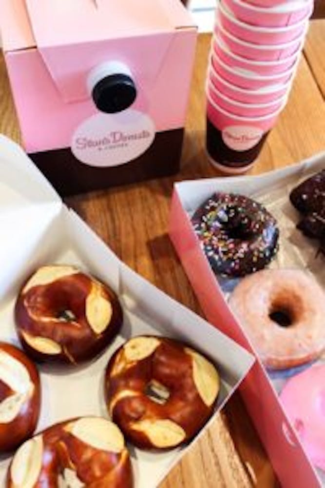 a box filled with donuts sitting on top of a table