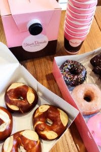 a box filled with donuts sitting on top of a table