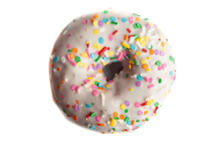 a hand holding a half eaten donut