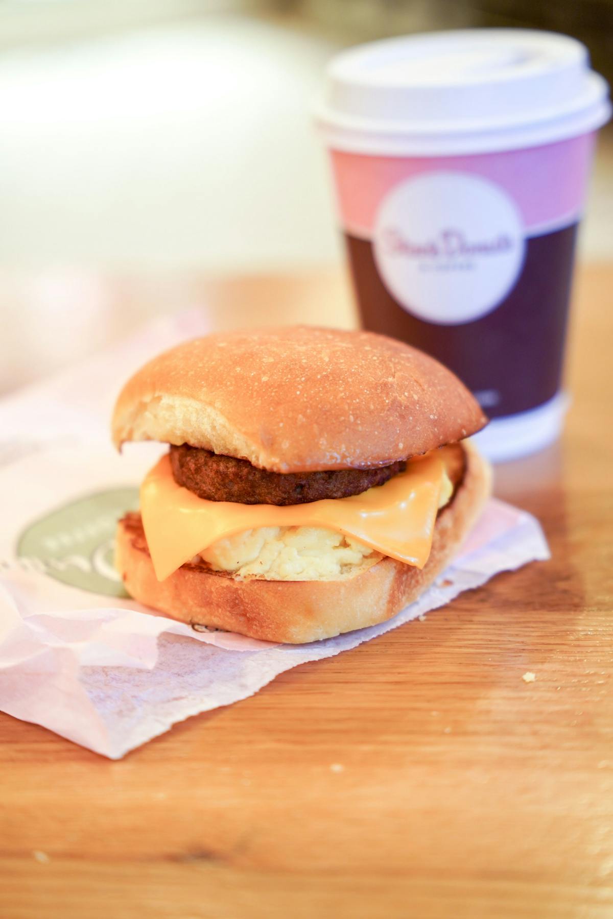 a close up of a sandwich sitting on top of a wooden table