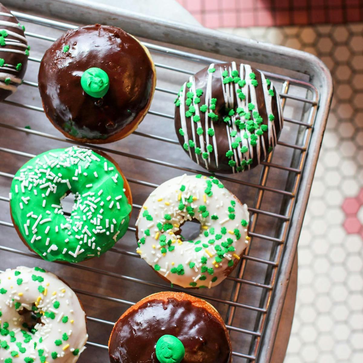 a group of assorted doughnuts on a table